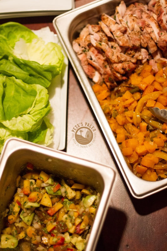 Lime, Garlic Wood Grilled Chicken Thighs with sautéed peppers, roasted butternut squash and a nectarine avocado salsa with butter lettuce wraps
