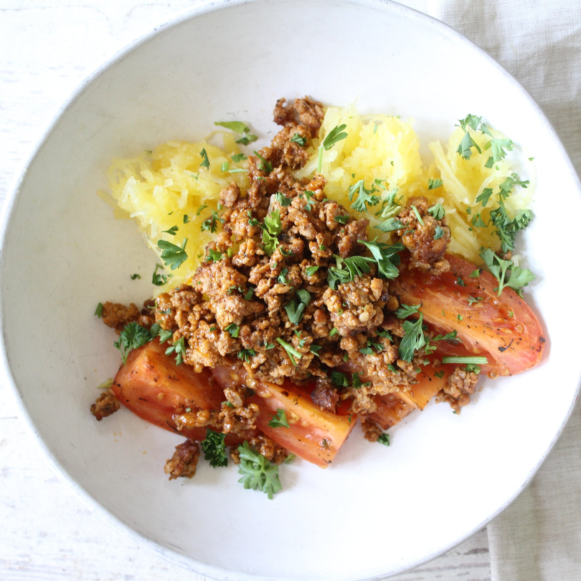 Chicken Chili with Oven Roasted Tomatoes over Spaghetti Squash - Pete's Real Food