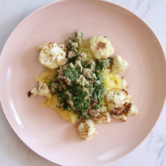 -Pesto Chicken over Spaghetti Squash and Roasted Cauliflower - Pete's Real Food