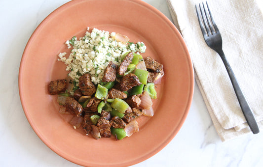 Carne Asada with Sautéed Peppers over Cilantro Cauliflower Rice